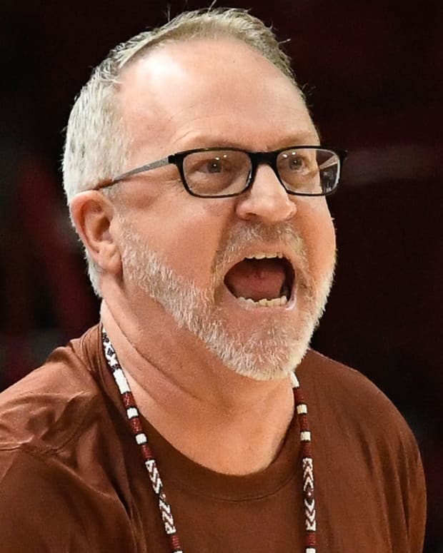 Razorbacks coach Mike Neighbors on the sidelines against UCA on Monday night